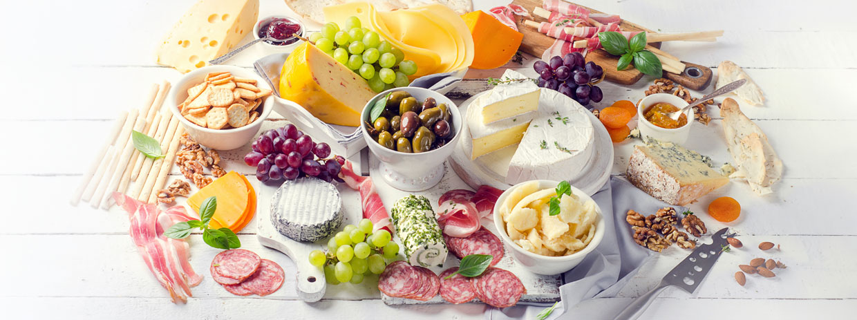 Local Catering Belmont: A delectable spread of cheeses, meats, and olives from Belmont Deli Catering.